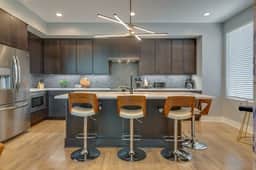Stylish 4Bed Retreat with Rooftop, Garage, Peloton  |  Sleeps 12, Fire Table, Gourmet Kitchen, Cozy Living Space, Dedicated Parking, Near Distilleries, Marathon Village & Nightlife, Chic Skyline Views, 24 Hour Hospitality - Image 3