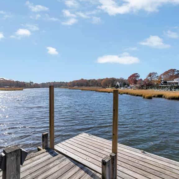 Waterfront Retreat with Private Dock and Fire Pit  |  Sleeps 8, Outdoor Dining, Spa-Style Primary, Chef’s Kitchen w/ Dual Dishwashers, Gas Fireplace, River Views, Bright Open Layout, Central A/C, Perfect Coastal Escape for Families, 24 Hr Hospitality - Image 1