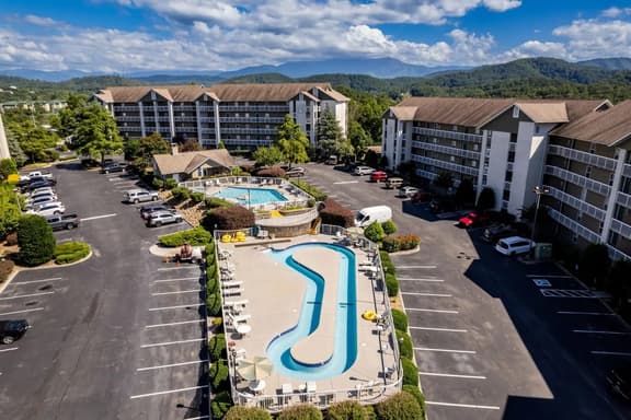 King Suites, Outdoor Pool+Lazy River Near Parkway  |  Covered Patio, Two King Suites and Queen Sleeper Sofa, Near Dollywood & Smoky Mountains, 24/7 Hospitality, Cozy Living Space - Image 1