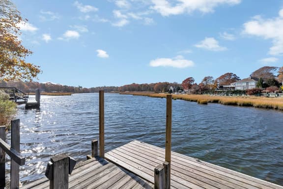 Waterfront Retreat with Private Dock and Fire Pit | Sleeps 8, Outdoor Dining, Spa-Style Primary, Chef’s Kitchen w/ Dual Dishwashers, Gas Fireplace, River Views, Bright Open Layout, Central A/C, Perfect Coastal Escape for Families, 24 Hr Hospitality - Image 1